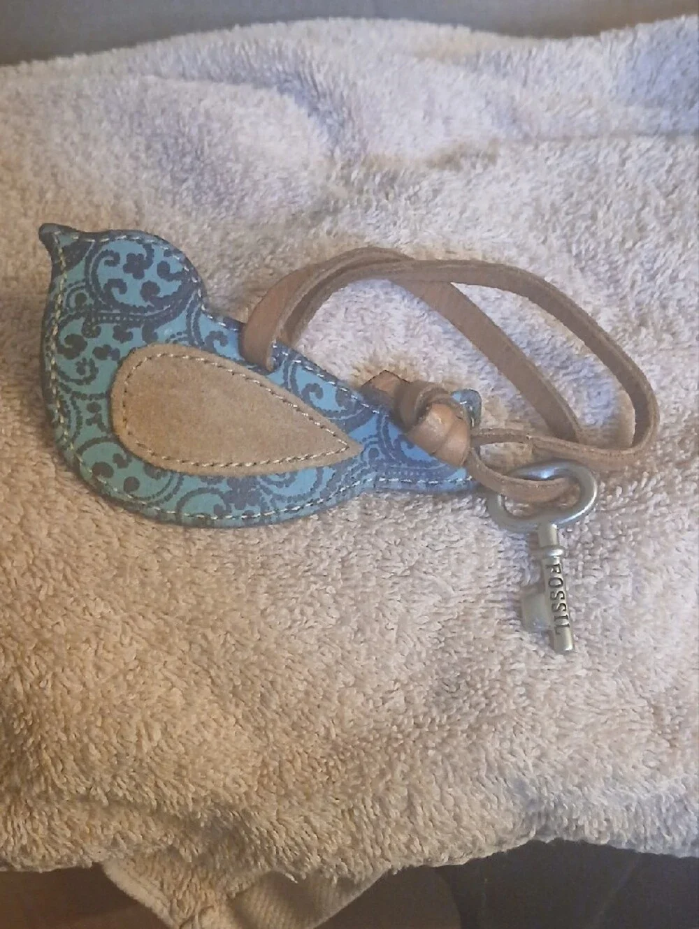 Fossil blue paisley leather bird keychain bag charm featuring a silver-toned key